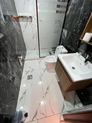 a bathroom with a sink and a toilet and a shower at Wadi Rum Star Sky in Wadi Rum