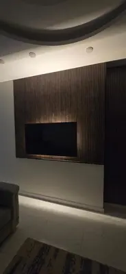 a fireplace in a room with a couch and a rug at شقق السعادة 2 in Amman