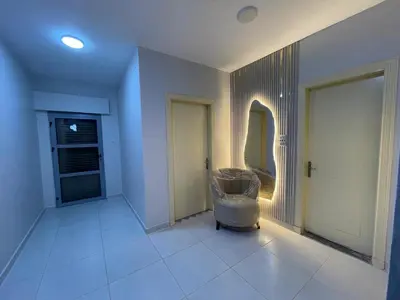 a room with a hallway with a door and a mirror at jordanien madaba in Madaba