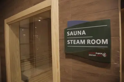 a sign on a window of a steam room at saraya stays premium in Amman