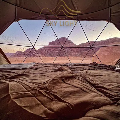 a view of a desert view from a tent at Skylight Wadi Rum Camp in Disah