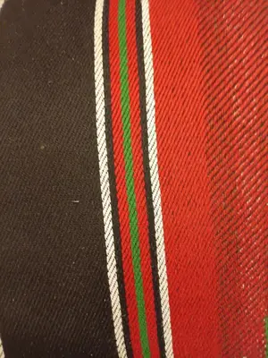 a close up of a red and green stripe on a hat at Rum Towers Luxury Camp in Aqaba