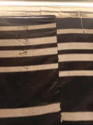 a black and white rug with white stripes at Rum Towers Luxury Camp in Aqaba