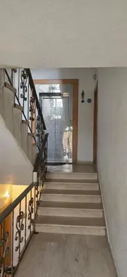 an empty hallway with stairs leading to a door at شقة مفروشة فاخرة in Amman