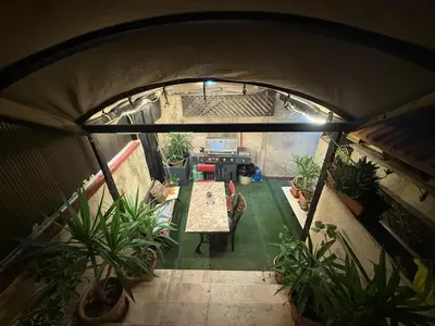 an overhead view of a room with plants at City huts in Umm Uthainah