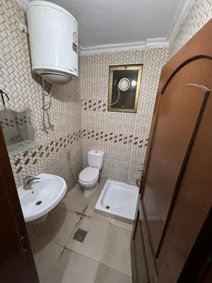 a small bathroom with a toilet and a sink at شقه للإيجار قرب جامعة اليرموك in Irbid