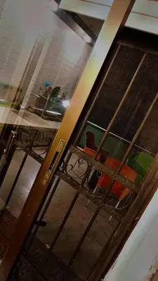 an open door to a room with a table and chairs at شقه مفروشه بالكامل متوفر فيها جميع الخدمات in Amman