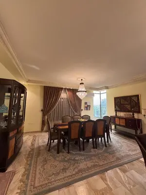 a dining room with a table and chairs at فيلا مميزة في عمان - Special Villa in Amman in Amman