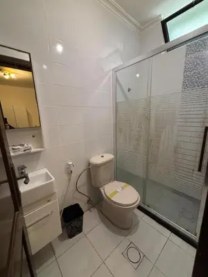 a bathroom with a toilet and a glass shower at فيلا مميزة في عمان - Special Villa in Amman in Amman