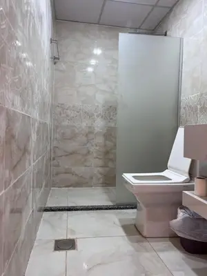a bathroom with a shower and a toilet in it at Wadi rum camp teem in Wadi Rum