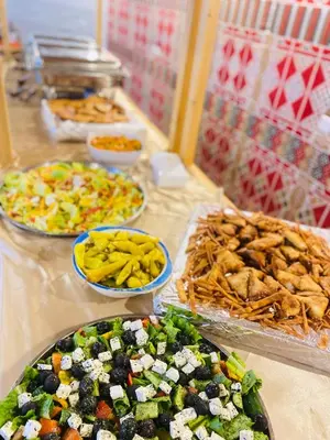 a buffet with many different types of food on a table at ULORA Luxury Camp in Wadi Rum