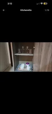 a picture of a shelf with cups and dishes on it at Qqq2 in Amman