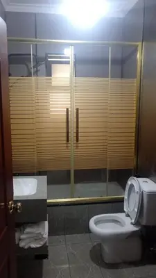 a bathroom with a toilet and a sink at Studio at the heart of Jabl Amman in Amman