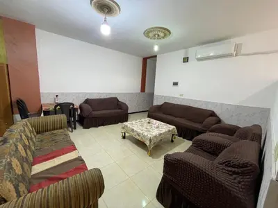 a living room with couches and a table at Jerash Skyline in Jerash