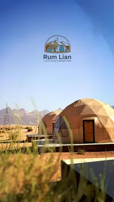 a yurt with a sign on it in the desert at Rum Lian Luxury Camp & Bubble Hotel in Disah