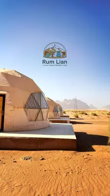 two tents in the desert with a sign on it at Rum Lian Luxury Camp & Bubble Hotel in Disah