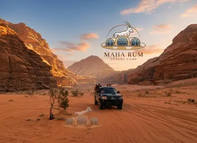 a truck driving through the desert with a tent at MAHA Rum Luxury Camp in Disah