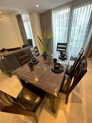 a dining room table with chairs and a dining room at luxury apartments at DAMAC tower amman للعائلات برج داماك in Amman