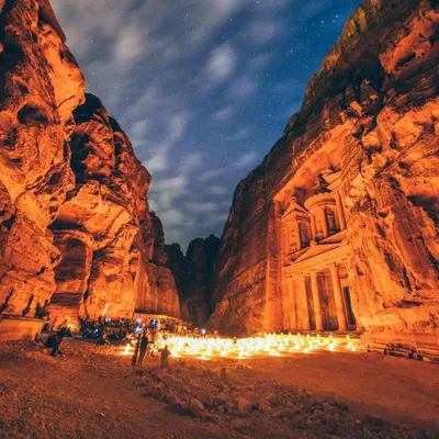 a canyon with a building in the middle of a mountain at Petra Gateway Guest Room in Wadi Musa