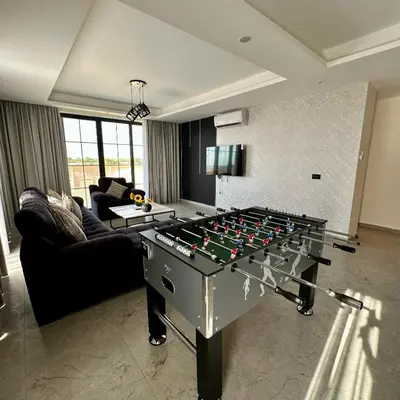 a living room with a large foos ball at Tonay I Villa by Seahorse in Al Rama