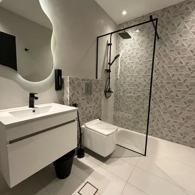 a bathroom with a toilet and a sink and a shower at Tonay I Villa by Seahorse in Al Rama