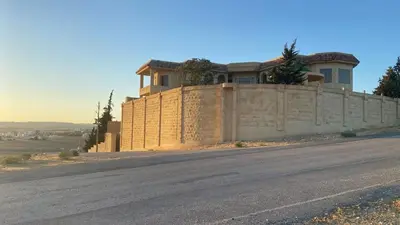 a house on the side of a wall at Appartment in Amman within a villa