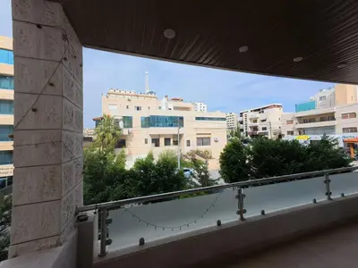 a view of a city from a balcony at 220 sqm 3 BR Um Al Summag, Makka Street