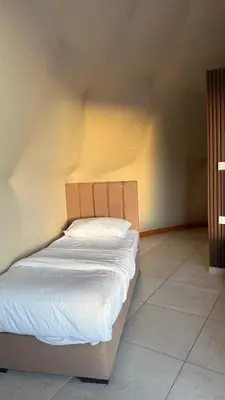 a small bed in a room with at sayd camp in Wadi Rum