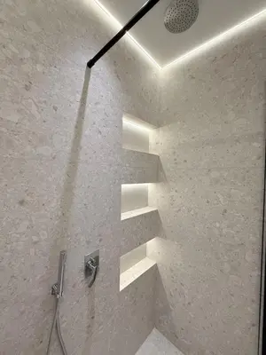 a stairway in a shower with at Luxury 3-Bedroom Apartment in Amman