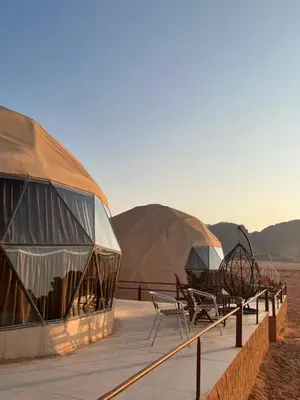 a group of tents in the middle of the desert at Imperial Rum Luxury Camp in Wadi Rum