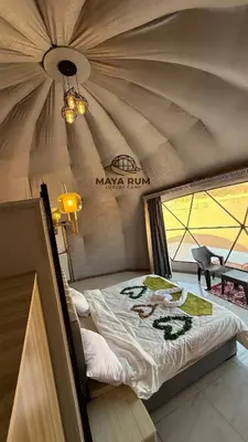 a room with a bed in a tent at MAYA RUM LUXURY CAMP & Jeep Tours in Disah