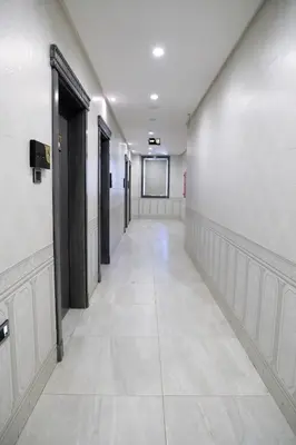 an empty hallway with a corridorngthngthngthngthngthngthngthngthngthngth at Nishan Hotel in Amman