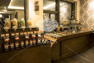 a dessert counter with many different types of desserts at Seven Roses Hotel in Amman