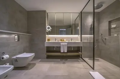 a bathroom with a sink and a toilet and a shower at Grand Hyatt Amman Residences in Amman