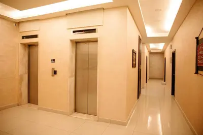a hallway with two doors in a building at Madina Suites in Amman