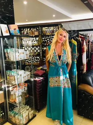 a woman in a dress in a store at P Quattro Relax Hotel in Wadi Musa