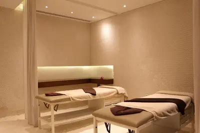 a hospital room with two beds and a window at Dead Sea Spa Hotel in Sowayma