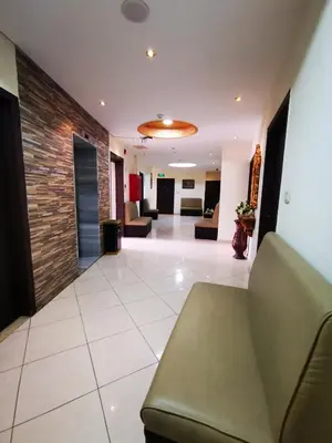 a lobby of a hospital with couches and chairs at Al Fakher Hotel Apartments & Suites in Amman