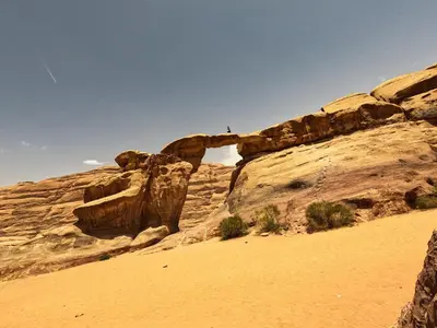 a rock formation in the desert with a mountain at Stargazing Camp & Tours in Wadi Rum