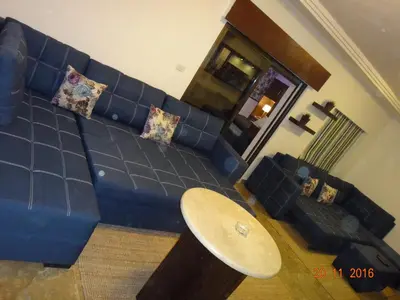 an overhead view of a blue couch in a living room at Royal Luxury Apartments & Studios 2 in Amman