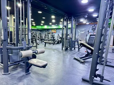a gym with a lot of equipment in it at Margarita Hotel in Amman