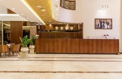 a lobby of a hotel with a reception desk at Gerasa Hotel in Amman