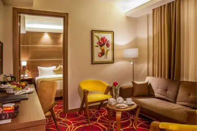 a living room with a couch and a table at Gerasa Hotel in Amman