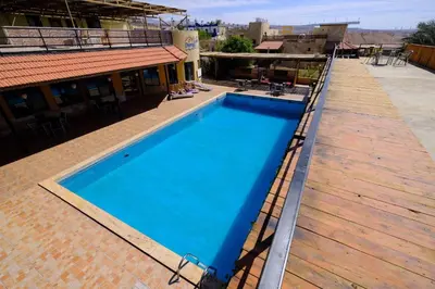a swimming pool on the roof of a building at Darna Divers Village in Aqaba