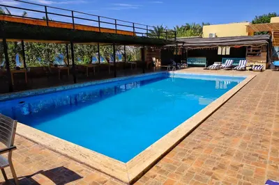 a large swimming pool with blue water at Darna Divers Village in Aqaba