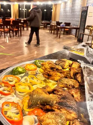 a tray of food with vegetables on a table at Panorama Wadi Rum in Wadi Rum