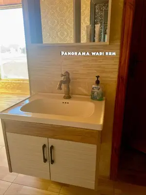 a white sink in a bathroom with a window at Panorama Wadi Rum in Wadi Rum