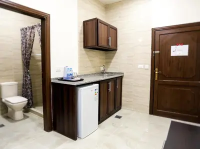 a small bathroom with a sink and a toilet at 7Boys Hotel in Amman