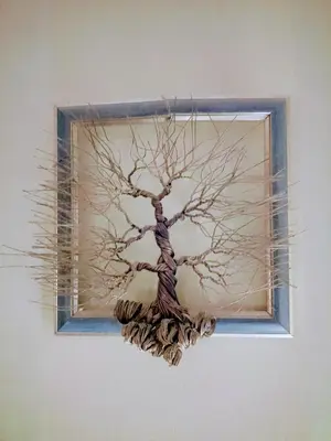 a painting of a tree on a wall at The Little B&B on the Hill in Wadi Musa