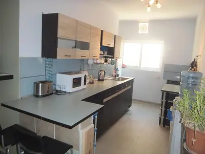 a kitchen with a counter and a microwave in it at The Little B&B on the Hill in Wadi Musa